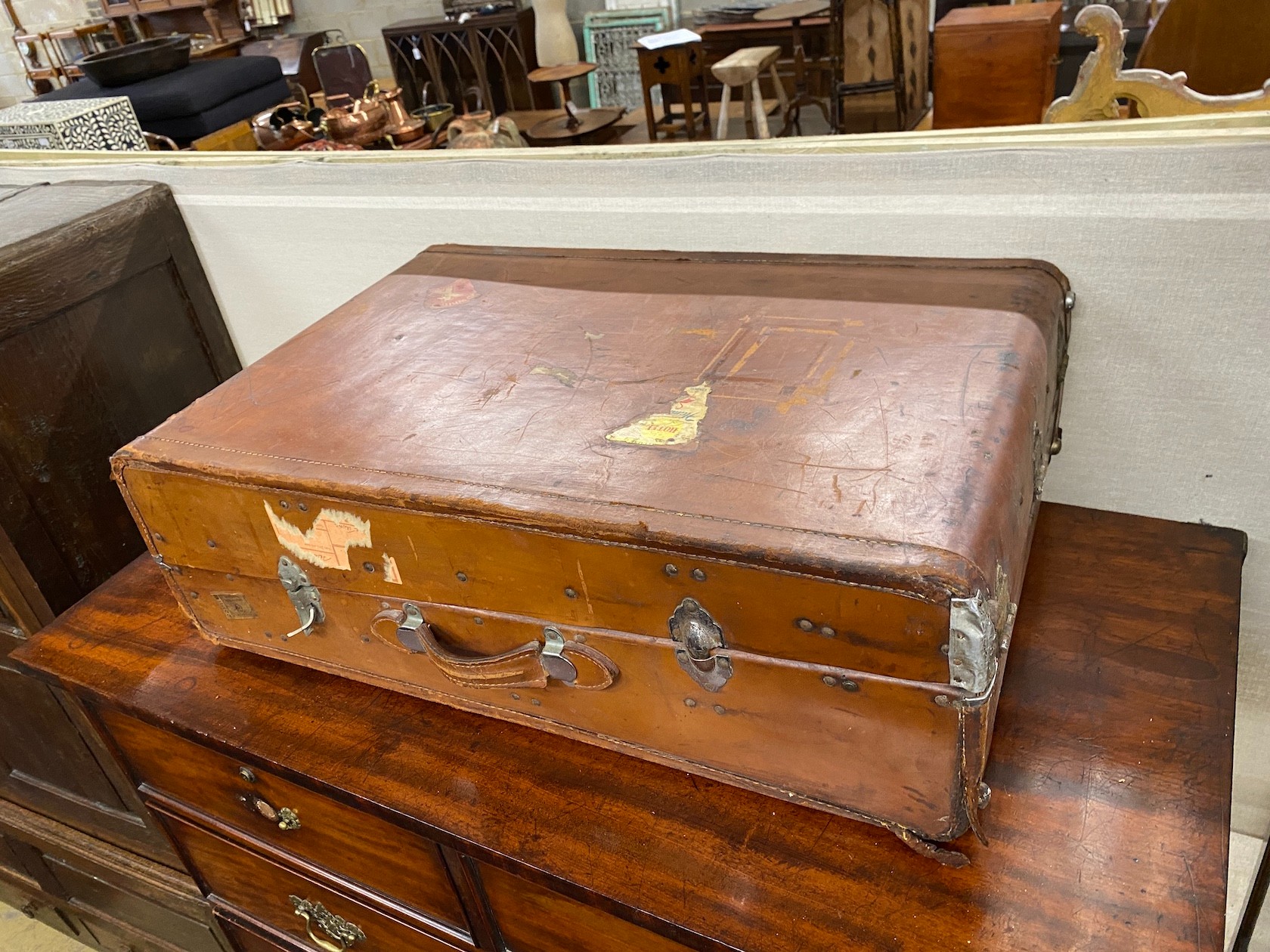 Four vintage suitcases, largest 82 x 53cm